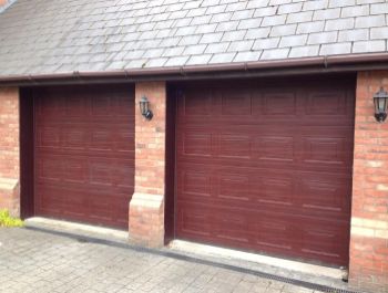 Two automatic insulated Georgian sectional doors in Rosewood